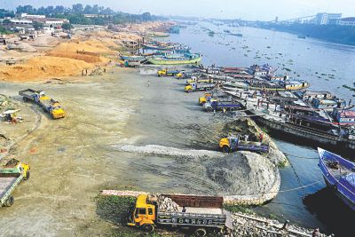 A major portion of river Shitalakkhya, almost up to its middle, is filled up by sand traders near Kanchpur Bridge in Naryanganj